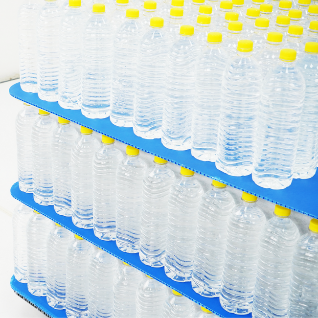 SheetGUARD honeycomb sheets and PP honeycomb panel protecting stacked packaged drinking water
